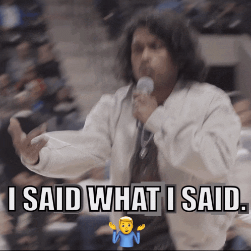 a man holding a microphone with the words " i said what i said " above him