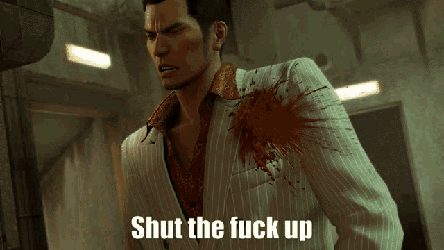 a man in a suit has blood coming out of his chest and the words shut the fuck up on the bottom