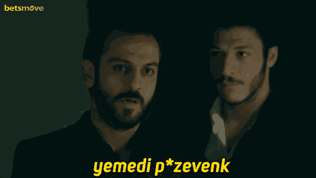 two men are looking at each other with a betsmove logo in the background