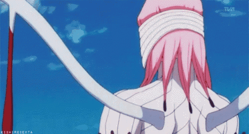 a girl with pink hair and white ribbons around her eyes is standing in front of a blue sky with tva in the background .