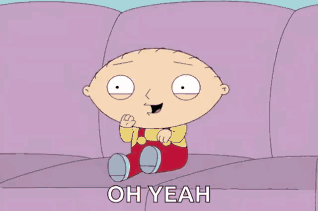 stewie from family guy is sitting on a purple couch .