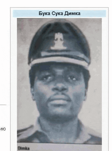 a black and white photo of a man wearing a hat with the name dimma on the bottom right
