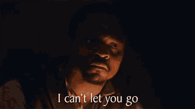a man says " i can 't let you go " in the dark