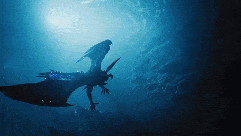 a dragon is swimming in the ocean with the sun in the background