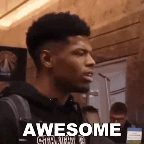 a man wearing a black shirt that says awesome