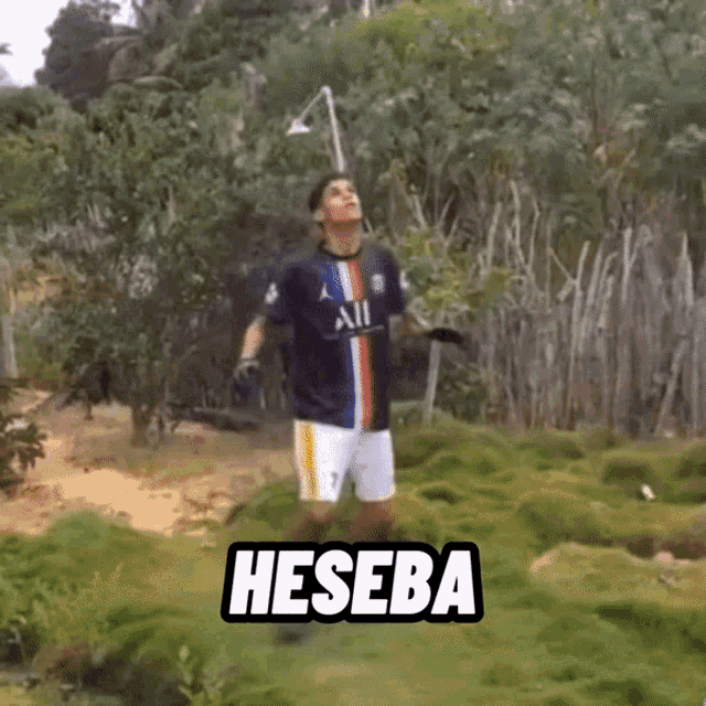 a man in an all jersey is standing in a field