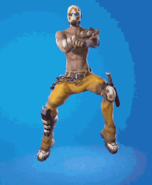 a man with a mask on his face is jumping in the air .