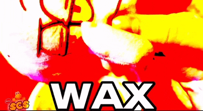 a person wearing glasses is holding a piece of wax on a red background .