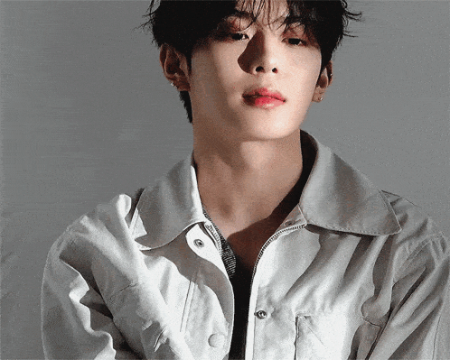 a close up of a man wearing a white jacket and red lipstick