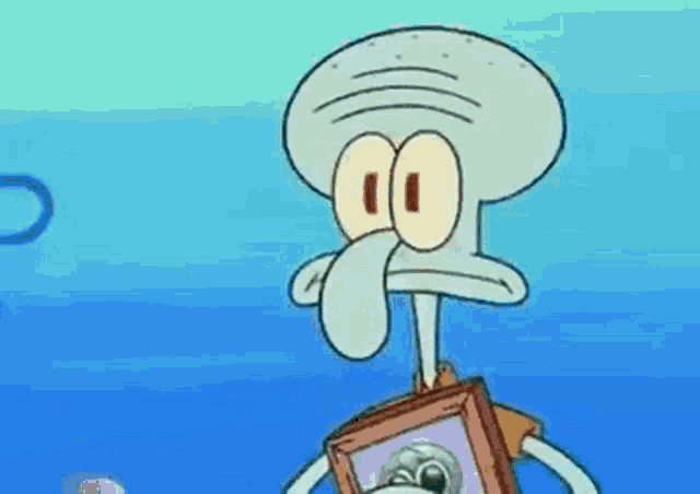 squidward from spongebob squarepants is holding a picture of a dog in a frame .