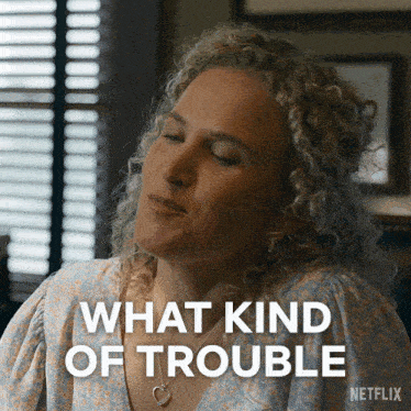a woman with curly hair says what kind of trouble on a netflix ad