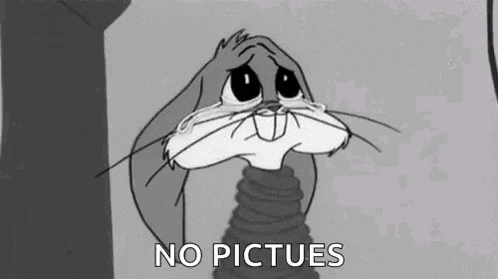 bugs bunny is crying in a black and white cartoon and says no pictures .