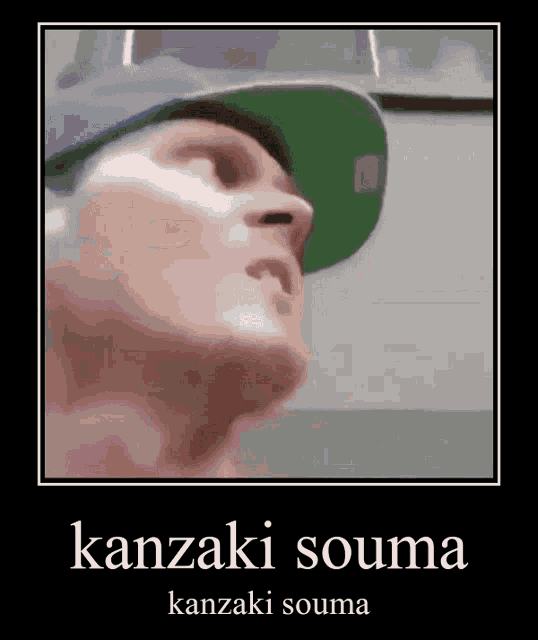 a man wearing a purple hat and a green hat with the words kanzaki souma on it .