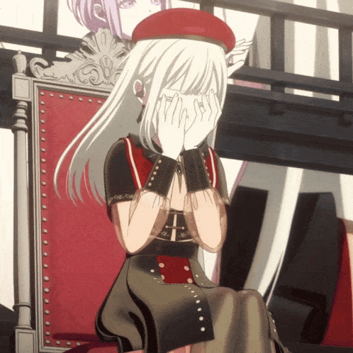 a girl with white hair is sitting in a chair with her hands on her face