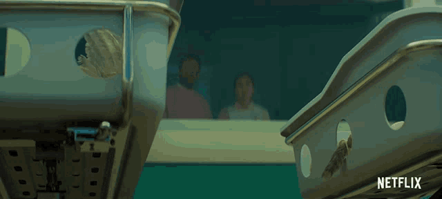 a netflix ad shows a man and a woman looking out of a window