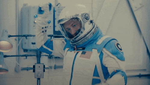 a man in a space suit with the name eddy on the front