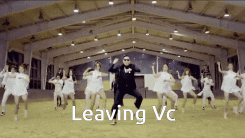 a man in a suit is dancing in front of a group of women and the words leaving vc are on the bottom