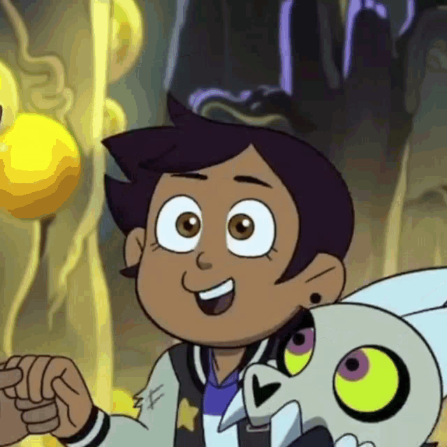 a close up of a cartoon character with a skull and a yellow ball .