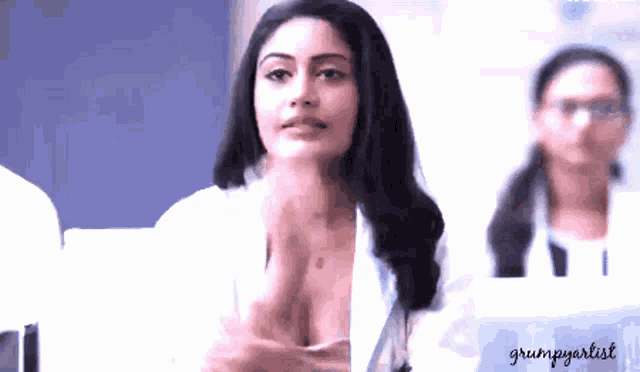 a woman in a white coat with the name grumpyartist on the bottom left