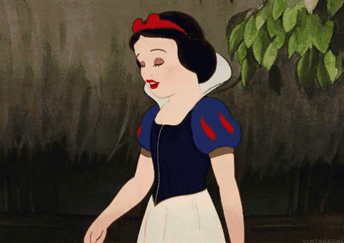 snow white from disney 's snow white and the seven dwarfs is walking in the woods