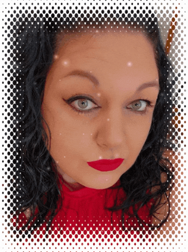 a woman wearing red lipstick and a red top