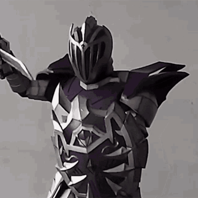 a knight in a purple and silver armor holding a sword