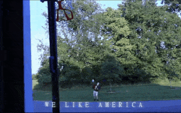 a sign that says we like america in white letters