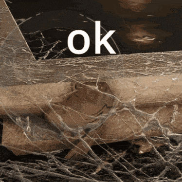 the word ok is on a broken glass surface