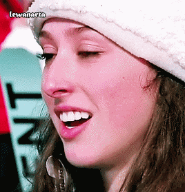a close up of a woman 's face with the name lewanarta on the bottom right