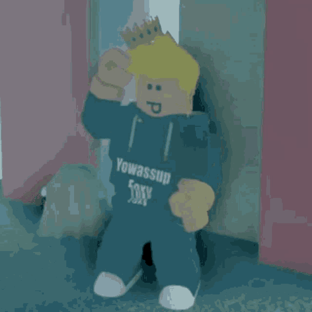 a roblox character wearing a crown and a hoodie that says yowass