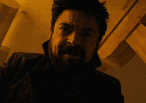 a close up of a man with a beard and mustache