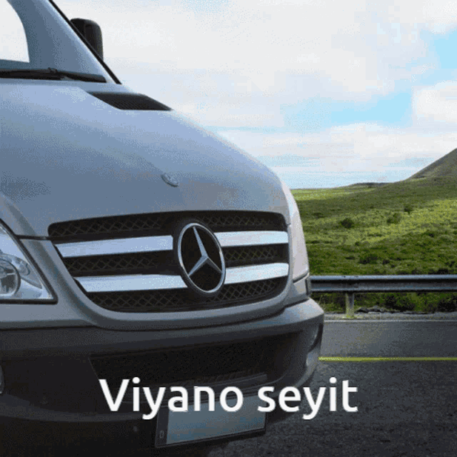 a mercedes van is parked on the side of the road with the words viyano seyit below it