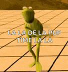 a kermit the frog is dancing on a tiled floor .