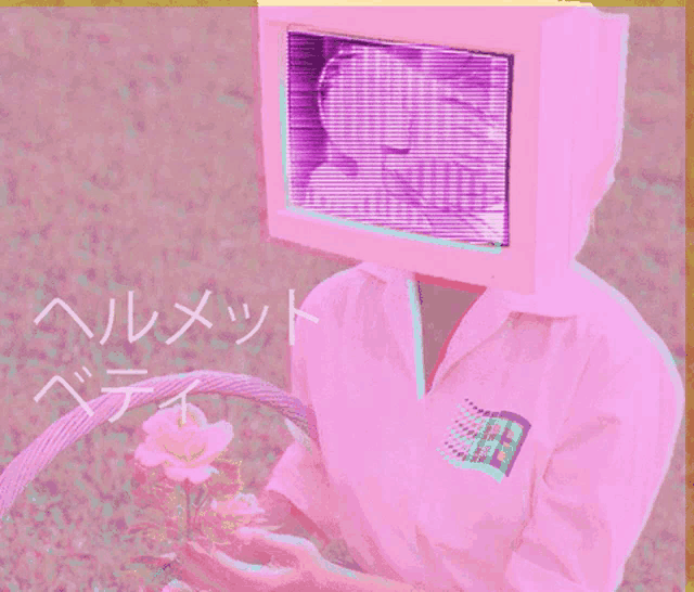a person with a computer monitor on their head holds flowers