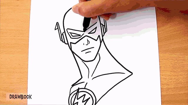 a person is drawing a flash on a piece of paper with drawbook written on the bottom
