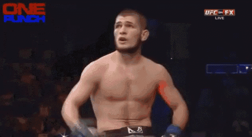 a man in a boxing ring with reebok shorts