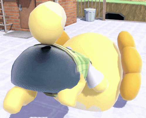 a yellow stuffed animal is laying on its back in front of a brick wall and a trash can