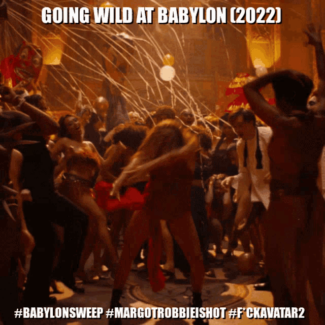 a group of people are dancing in a room with the caption going wild at babylon
