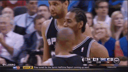 a basketball game is being played on a television screen