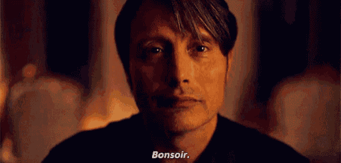a close up of a man 's face with the word bonsoir written on it .