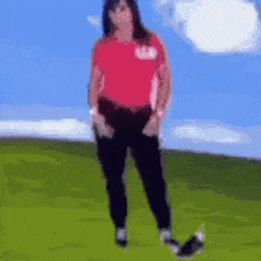 a blurry picture of a woman in a red shirt