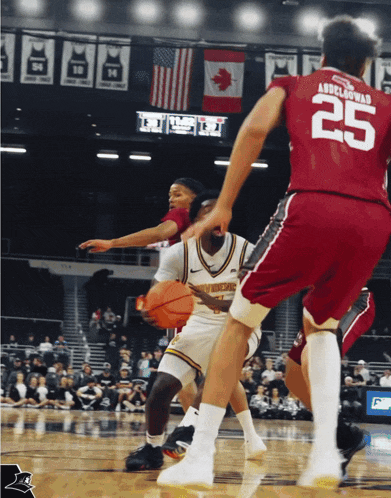 a basketball player with the number 25 on his jersey dribbles the ball