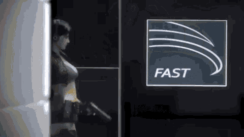 a woman is standing in front of a sign that says fast