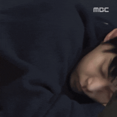 a close up of a person 's face with mbc in the corner