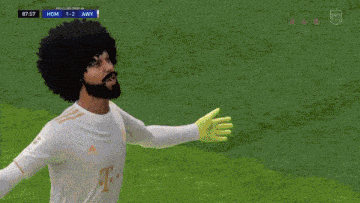 a soccer player with an afro and a beard is wearing a white shirt with t on it