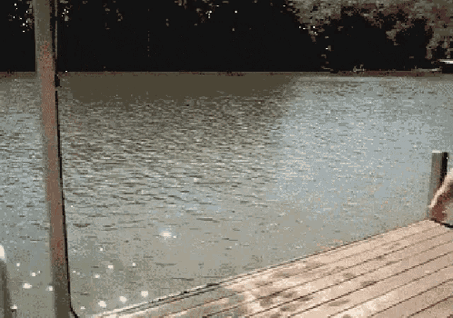 a pixelated image of a dock overlooking a lake