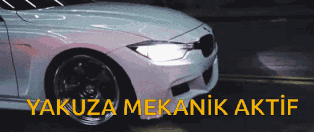 a white car with yakuza mekanik aktif written on the bottom