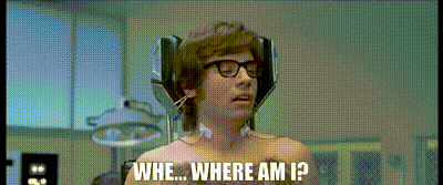 a shirtless man wearing glasses and headphones is asking where am i ?