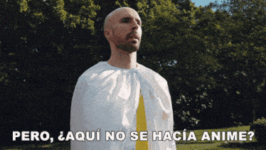 a man wearing a white cape and a yellow tie says pero