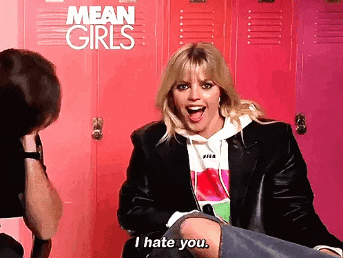 a woman says i hate you in front of a pink locker
